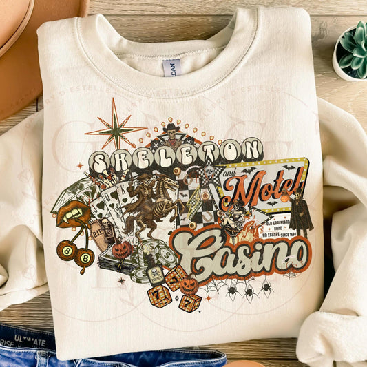 White sweatshirt with Halloween-themed design featuring text and graphics on a wooden surface.