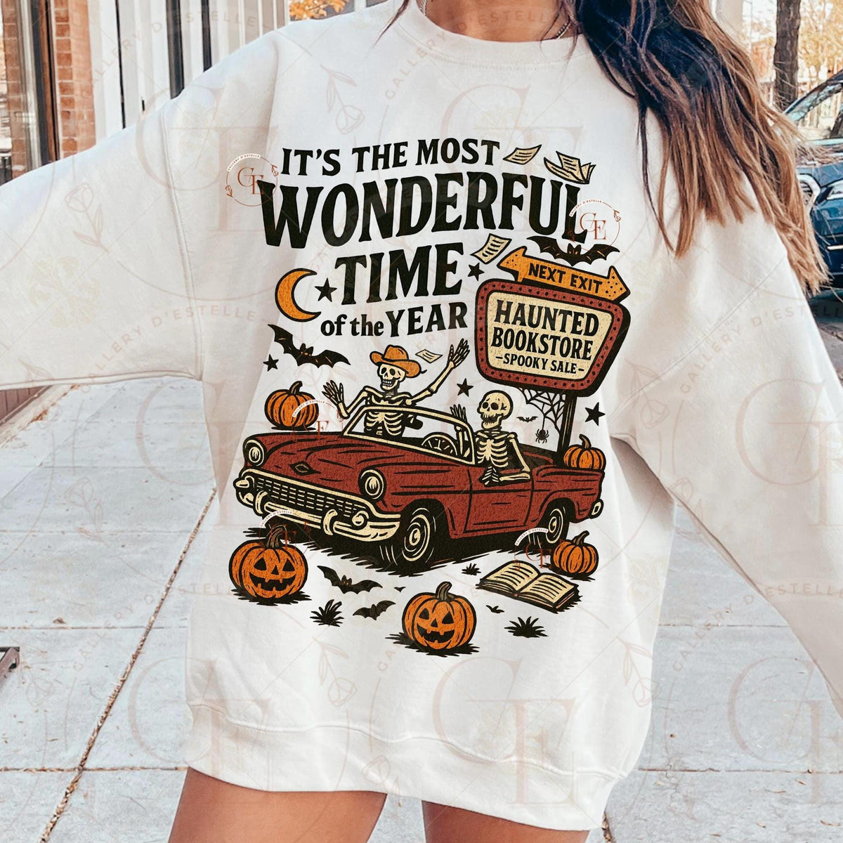 Person wearing a Halloween-themed sweatshirt with graphics and text.