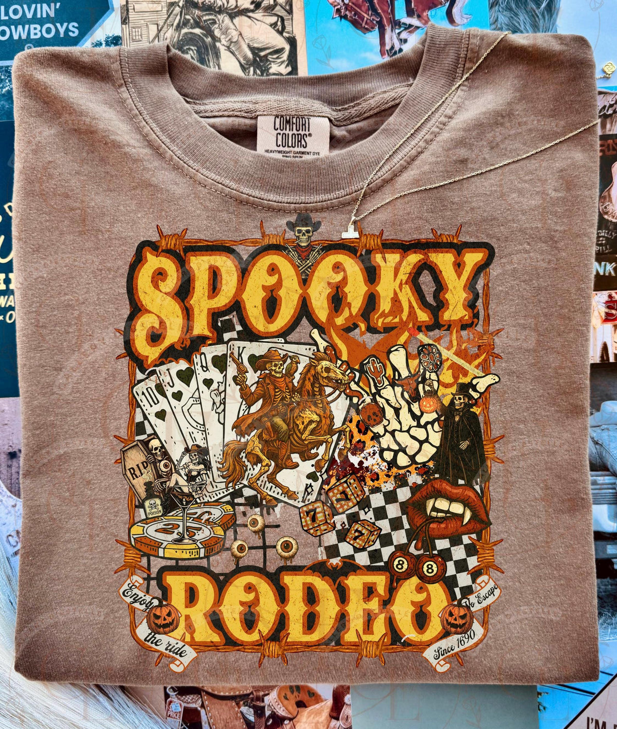 Brown sweatshirt with 'Spooky Rodeo' graphic design on a collage background