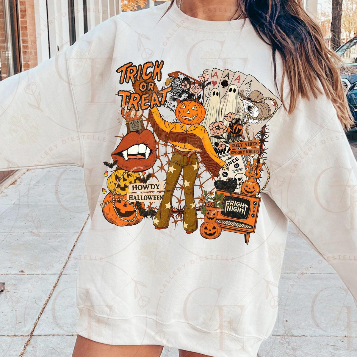 Person wearing a white t-shirt with Halloween-themed graphics.